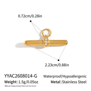 Detailed view and measurements of gold T-shaped zircon pendant in stainless steel