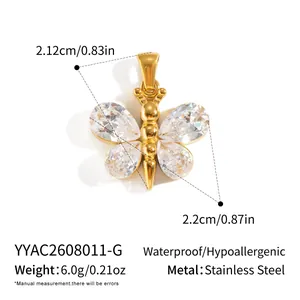 Detail view of gold butterfly pendant with zirconia stones and size dimensions