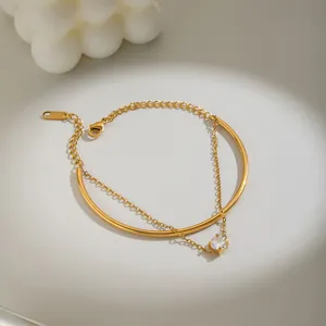 Detail view of a luxury 18K gold plated stainless steel bracelet with round zircon