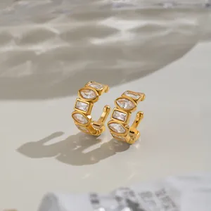 Detailed view of vintage geometric zircon ear cuffs in gold-plated stainless steel.