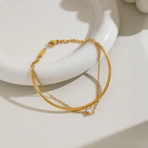 Close-up of 18K gold plated stainless steel bracelet with a round cubic zirconia stone