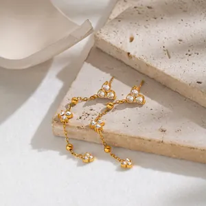 Close-up detail of French retro 18K gold plated zircon long chain tassel earrings.