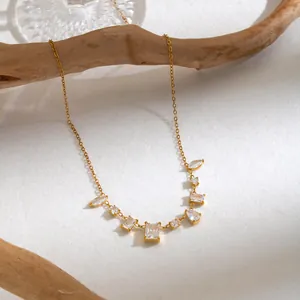 Detailed macro shot of a French vintage 18K gold plated necklace with geometric zircons.