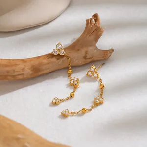 Close-up of 18K gold-plated stainless steel tassel earrings with sparkling zircons