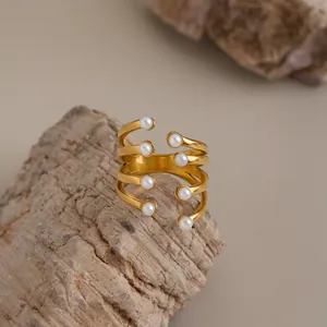 Detailed view of adjustable multi-layer 18K gold plated ring with elegant pearls.