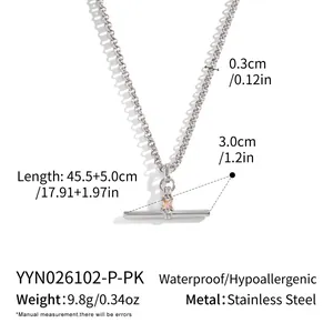 Detailed view of a stainless steel T-bar necklace with pink zircon and dimensions