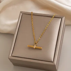 Elegant T-bar pendant necklace with shimmering zircons presented on a premium jewelry gift box