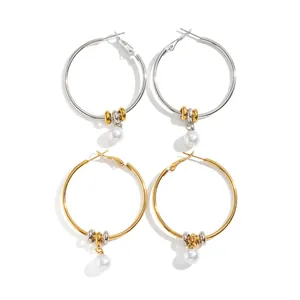 Elegant minimalist stainless steel hoop earrings with 18K gold plating and pearl charms.