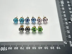 Multi-color crystal stud earrings set with size reference on ruler measuring 10mm diam