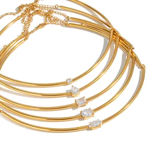 Set of minimalist 18K gold plated stainless steel chokers with various zircon shapes.