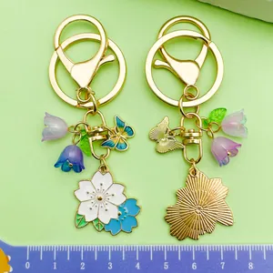 Macro detail of cute floral cherry blossom keychains with scale ruler for size reference