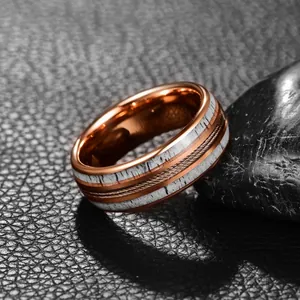 Detailed view of 8mm rose gold tungsten steel ring featuring antler inlay and steel wire.