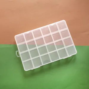 Detailed top view of a 24-compartment clear plastic organizer for DIY jewelry beads