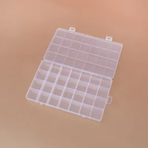 Detailed view of the 28-compartment clear plastic organizer for beads and jewelry.
