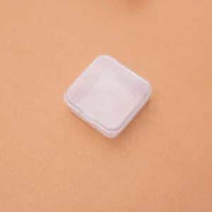 Macro view of a 5cm small square transparent PP plastic jewelry storage box with flip lid