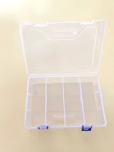 Vista detallada de caja organizadora de plástico de 8 compartimentos con cierres azules