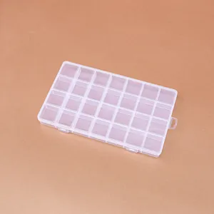 Close-up of 28-compartment transparent plastic storage box for jewelry beading DIY crafts