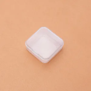 Detailed view of a small square transparent PP plastic storage box with flip-top lid