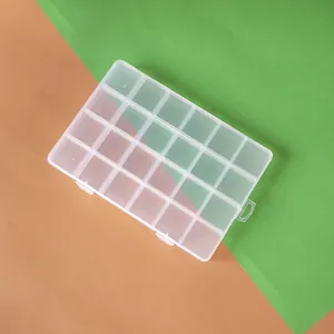 Top-down detail of 24-grid clear plastic storage organizer for DIY jewelry beads and crafts