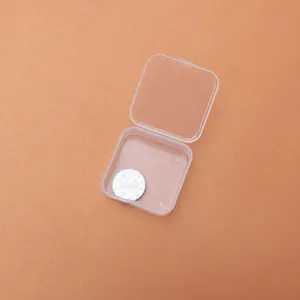 Detail of small clear square PP plastic box with coin for size reference