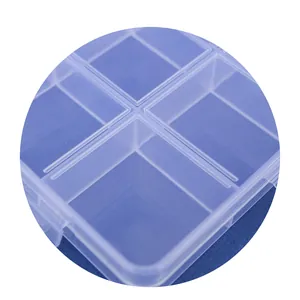 Close-up detail of the 15-grid clear plastic storage box for hardware and loose beads