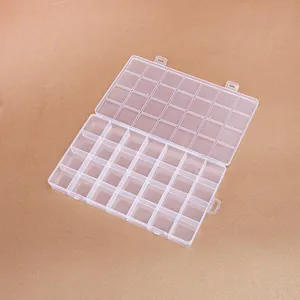 Close-up of a 28-compartment clear plastic organizer box for jewelry and beads
