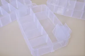 Detailed view of clear plastic organizer box with adjustable removable dividers.