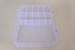 Detail view of transparent plastic storage box with adjustable dividers and handles