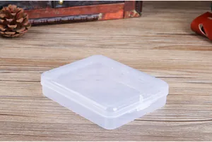 Detail view of a small transparent plastic storage box for makeup puffs and tools