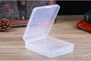 Detailed view of an open transparent plastic storage box for makeup sponges and lashes