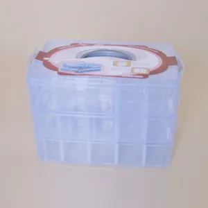 Detailed view of 3-layer 30-grid clear plastic storage box with portable handle.