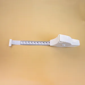 Close-up of white retractable tape measure showing Y-shaped handle and 1-10cm scale