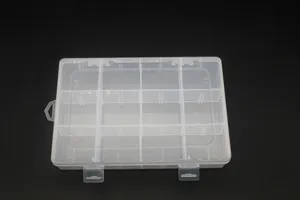 Macro detail of the 12-grid transparent plastic storage box with secure lid