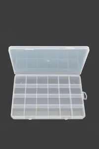 Detail of a 24-compartment transparent plastic storage box with fixed internal dividers.