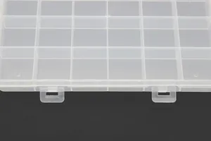Close-up detail of a 24-grid transparent plastic storage box showing hinges and slots