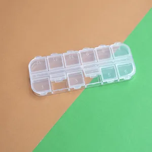Detalle de las 12 tapas individuales y la textura de plástico transparente de la caja
