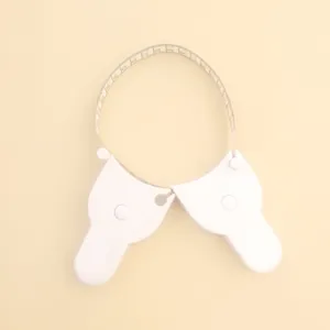 Detail view of a white Y-shaped body measuring tape featuring cm and inch scales