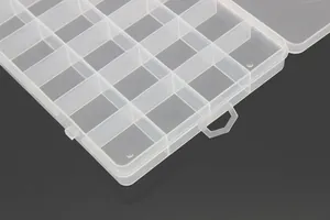 Close-up macro view of the fixed grids in a transparent 24-compartment plastic box
