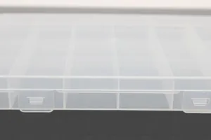 Close-up detail of 24-grid fixed transparent plastic storage box with secure latches
