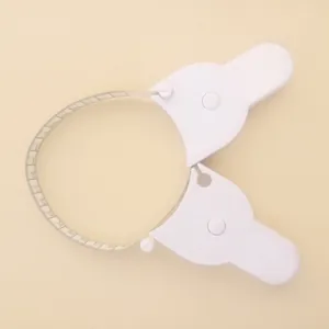 Detailed view of white Y-shaped body measurement tape with cm and inch markings