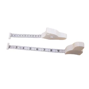 White Y-shaped retractable body tape measure showing both inch and centimeter scales