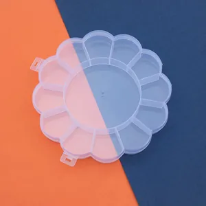 Transparente blumenförmige Kunststoffbox mit 13 Fächern für Perlen und Schreibwaren