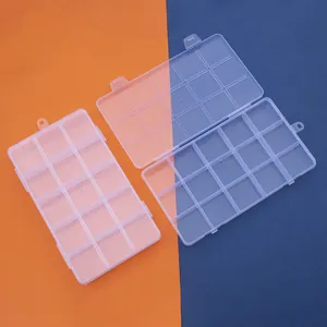 Detail of transparent 15-compartment plastic storage box with secure double latch