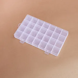 Detailed top view of 28-compartment clear plastic organizer box for jewelry