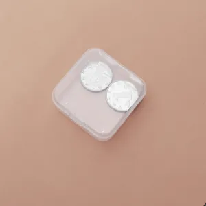 Clear square PP plastic storage box with flip lid containing two coins for scale