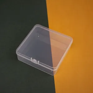 Macro view of a 11.5cm square clear plastic storage box for small jewelry items