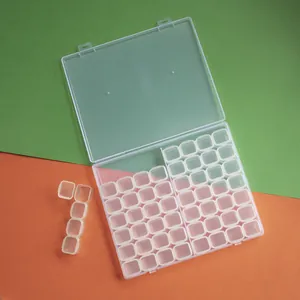 Detail view of a 56-compartment clear plastic organizer for diamond painting and jewelry