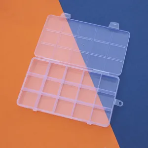 Overhead view of a clear 15-compartment plastic storage box for beads and jewelry parts