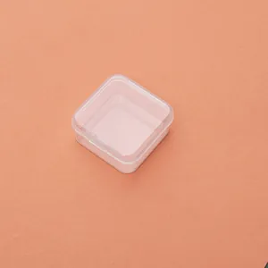 Close-up of a 5cm transparent square PP plastic box with a functional hinged lid