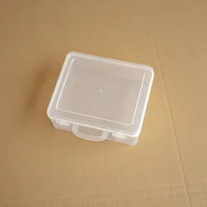 Detailed top view of a small transparent plastic storage box featuring a portable handle.